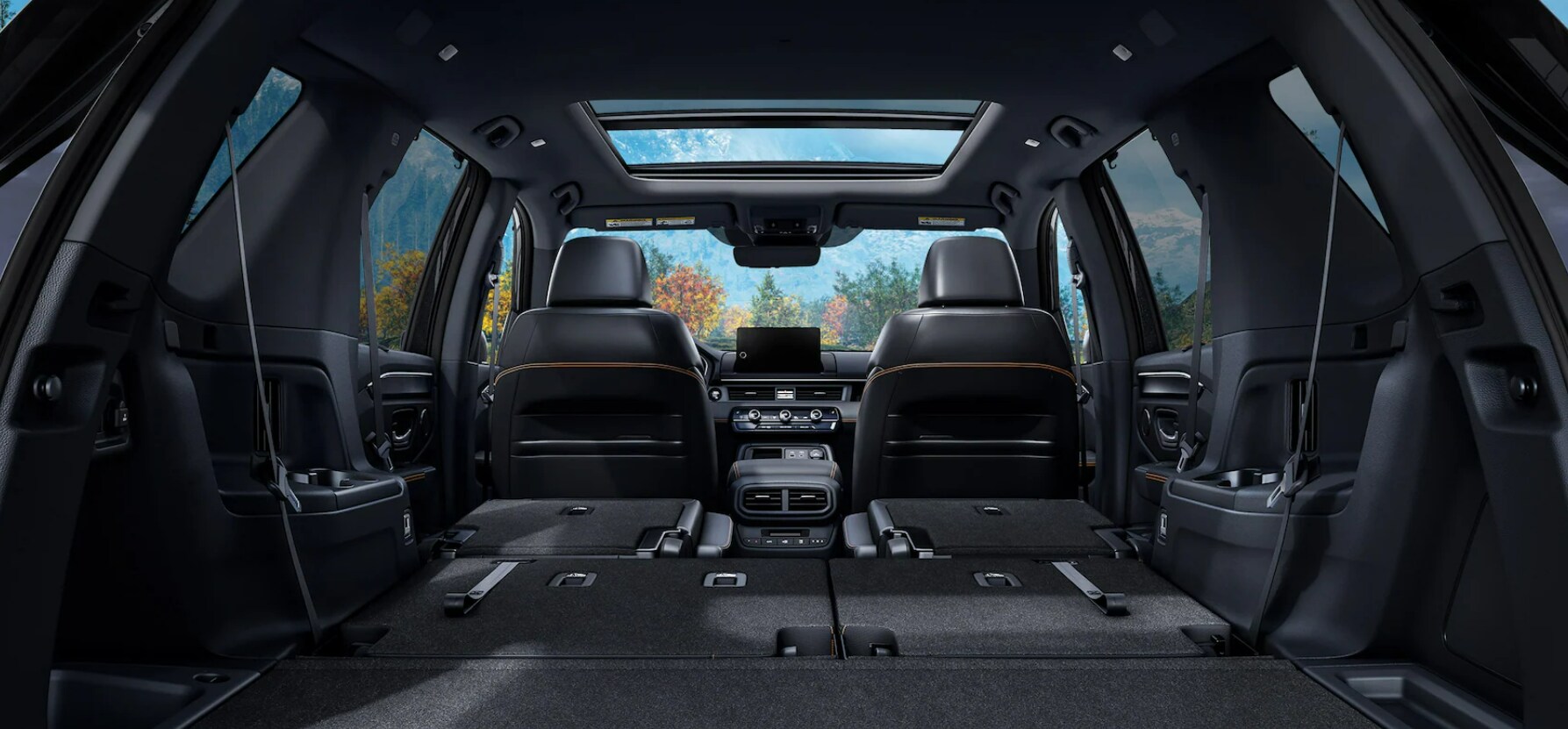 The interior of a 2025 Honda Pilot with all of the seats down.