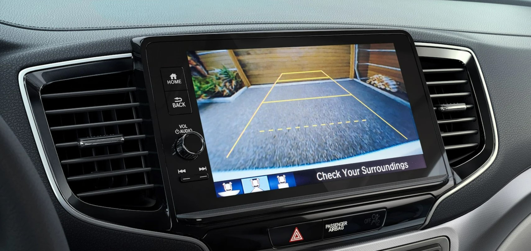 The infotainment screen showing a view of the back up camera.