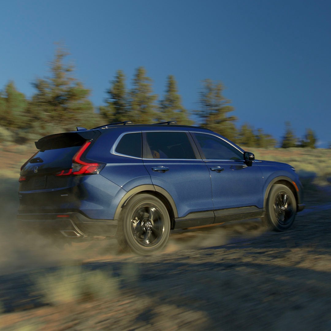 Honda CR-V TrailSport Hybrid kicking up dust on a Colorado dirt road