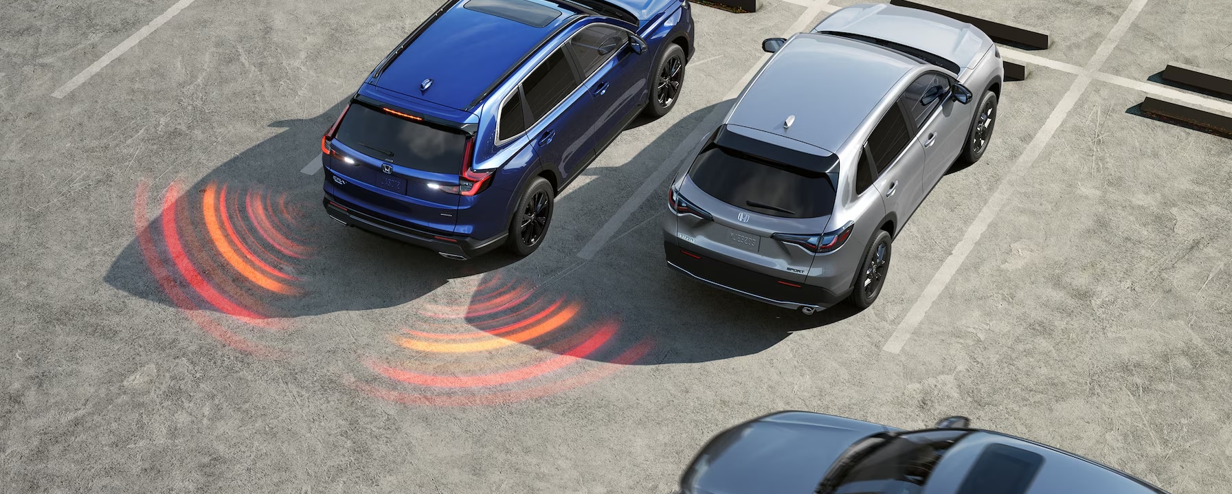 A 2025 Honda CR-V backing up showing it's backup sensors.