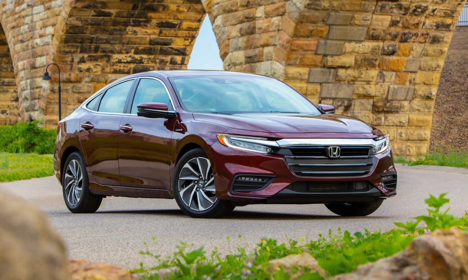 New 2021 Honda Insight Hybrid Touring model driving at night on the open road