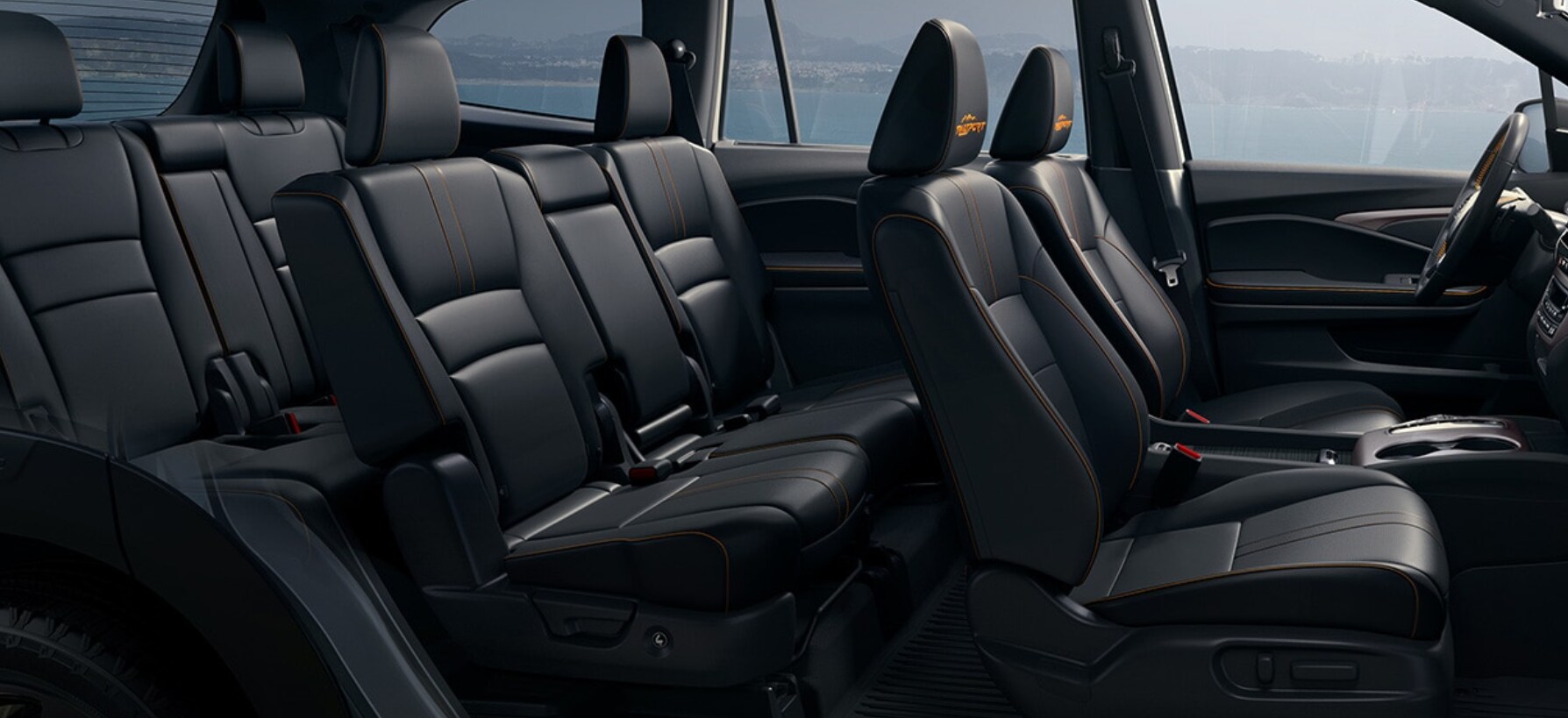 A view of the cabin of a 2022 Honda Pilot upholstered in black leather