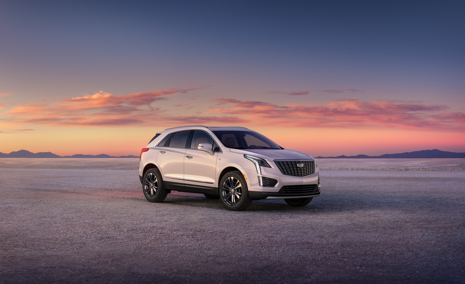 Cadillac XT5 parked in the desert after sunset