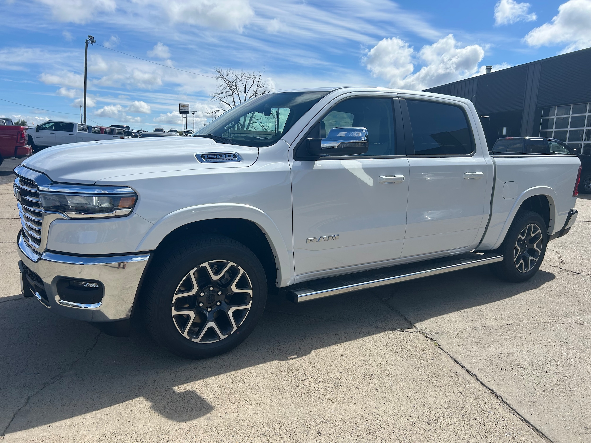 2026 Ram 1500 LARAMIE CREW CAB 4X4 5'7 BOX - Ivory White Tri-Coat Pearl-Coat  Paint exterior view 2