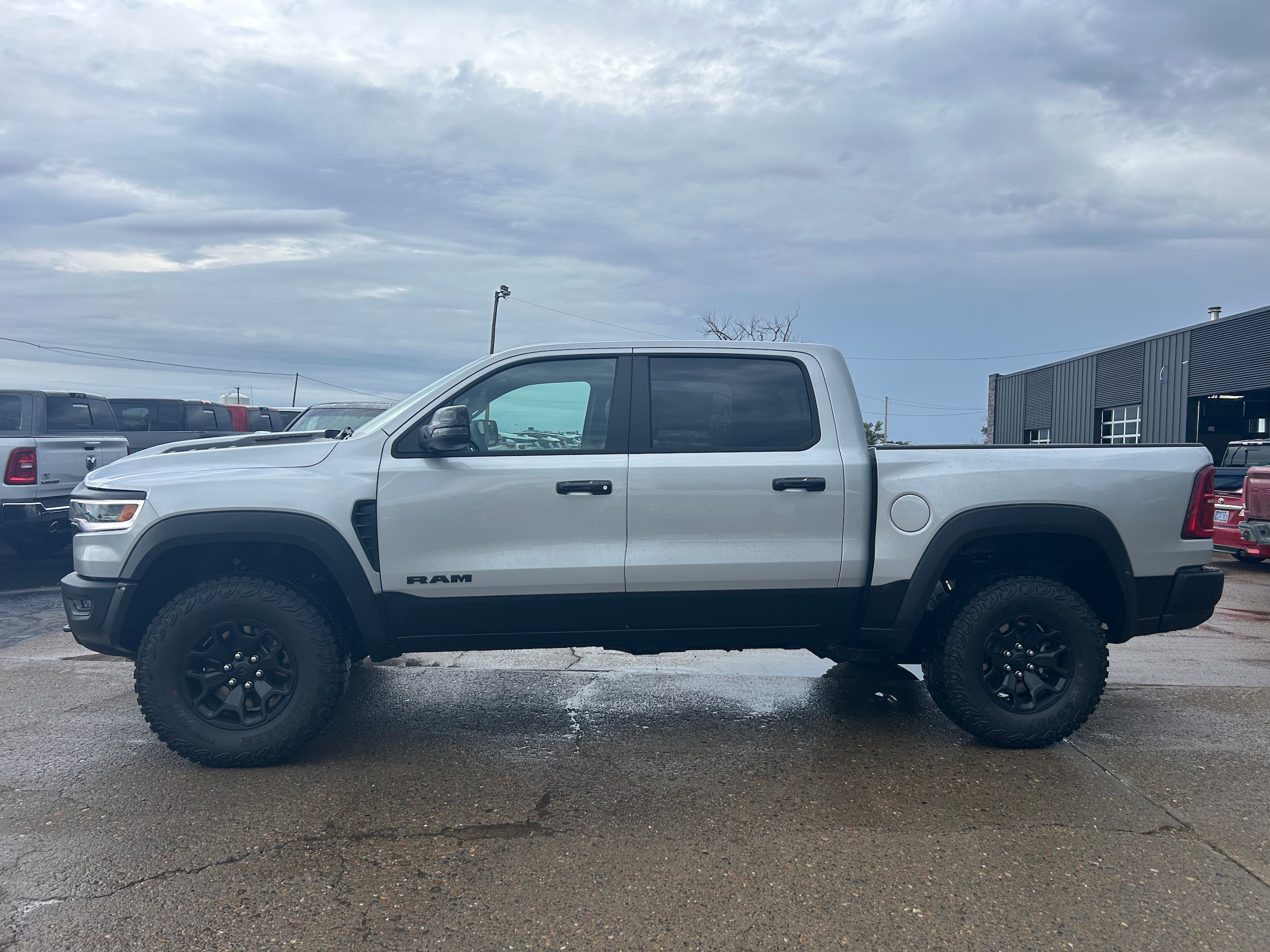 2026 Ram 1500 RHO CREW CAB 4X4 5'7 BOX - Silver Zynith Paint exterior view 3