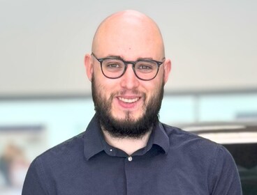 Staff member Caleb Fox from 5c6c218122c1