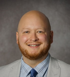 Staff member Kyle Boston from ID_7084a97c5700