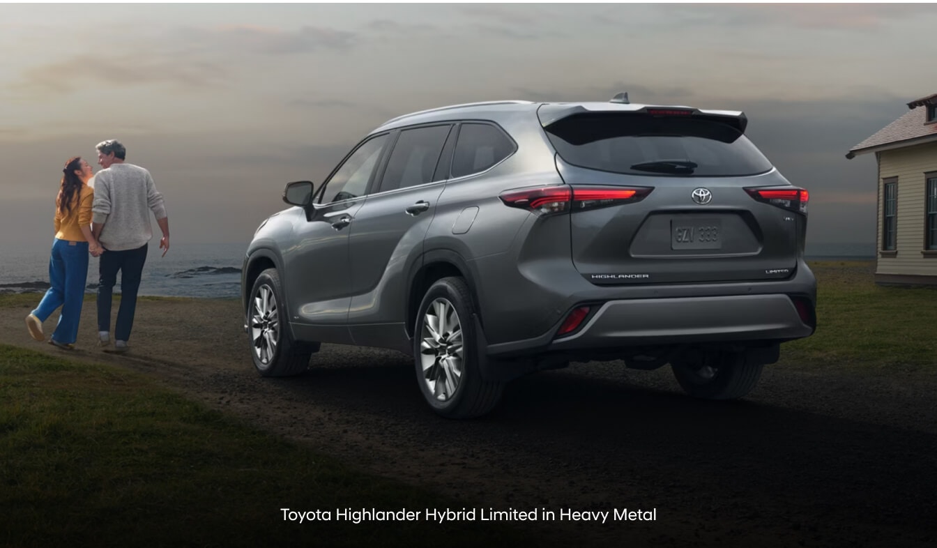 Toyota Highlander Limited in Heavy Metal with rear spoiler on coastal trail.