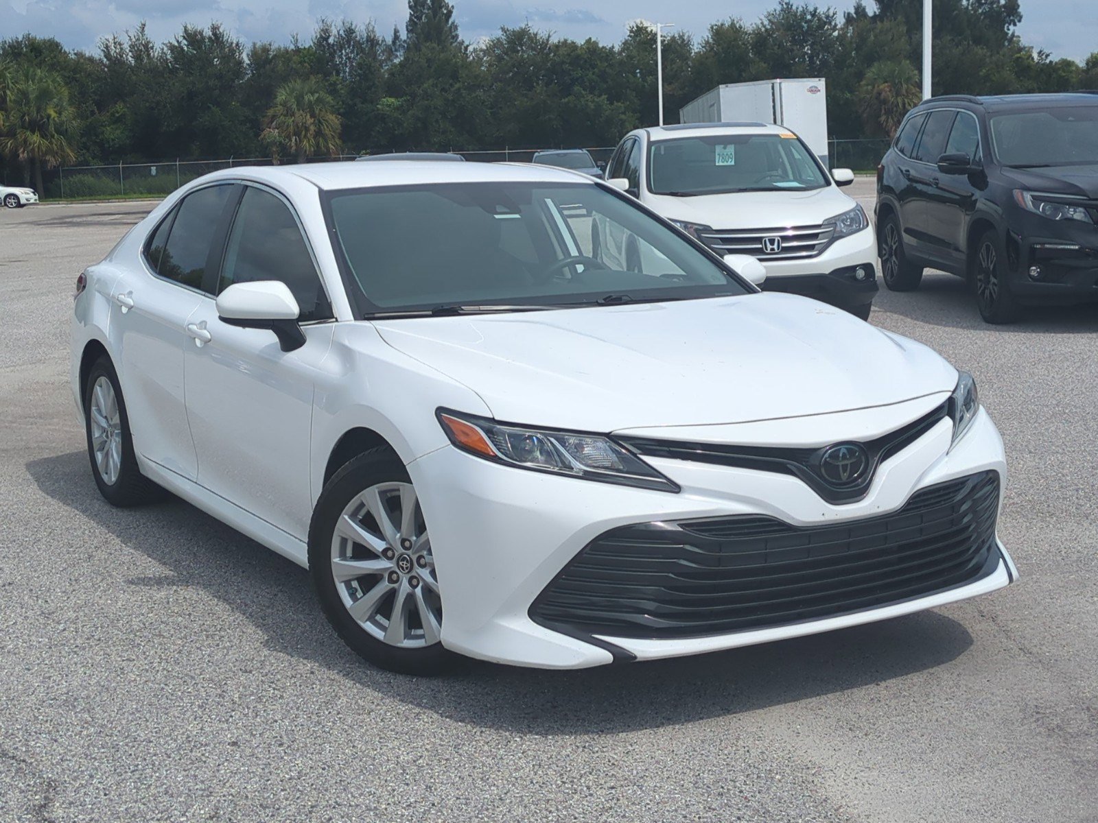 Used 2019 Toyota Camry LE with VIN 4T1B11HK2KU771990 for sale in Bradenton, FL