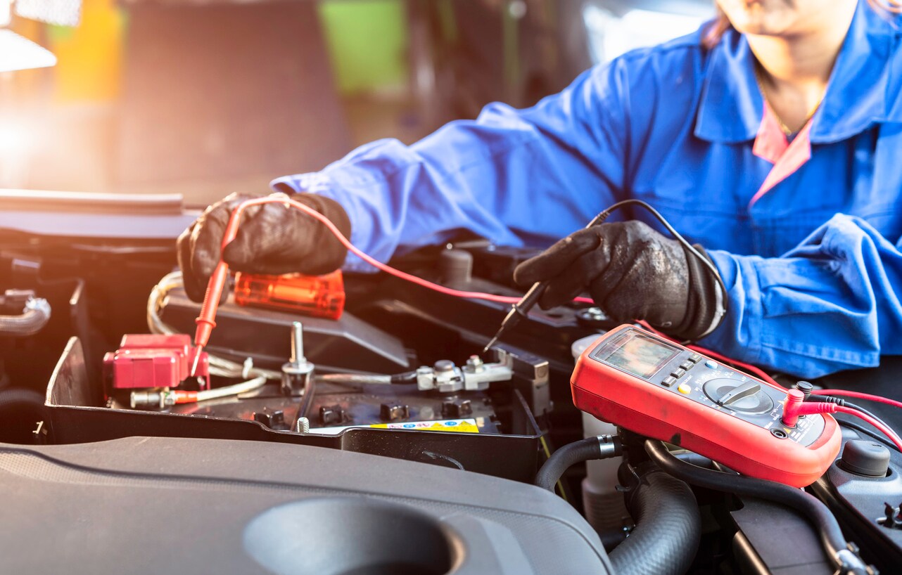 technician working on car battery