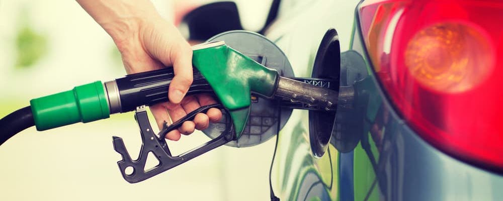 man at gas pump