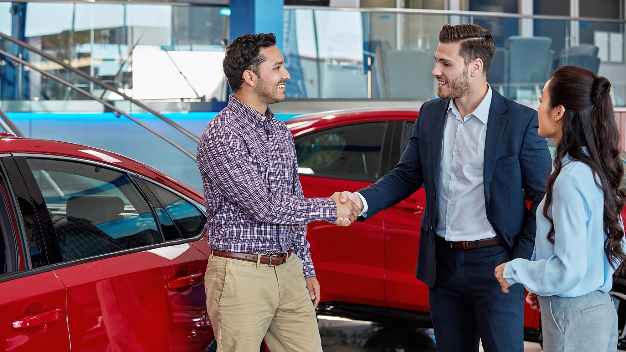 Red cars in a delaership with the customers