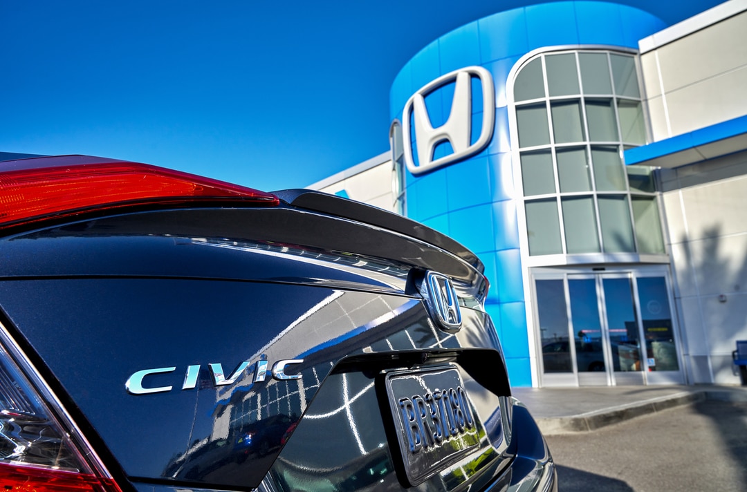  Person cheerfully signing documents.