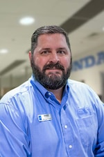 Staff member George Powell from ID_bd25c938baee
