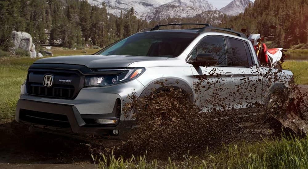 A silver 2025 Honda Ridgeline HPD Sport for sale in Southgate off-roading.