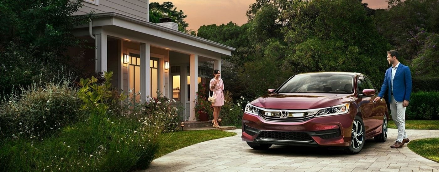 A maroon 2017 Honda Accord LX is shown on a driveway after visiting a used car dealer near Grosse Ile.