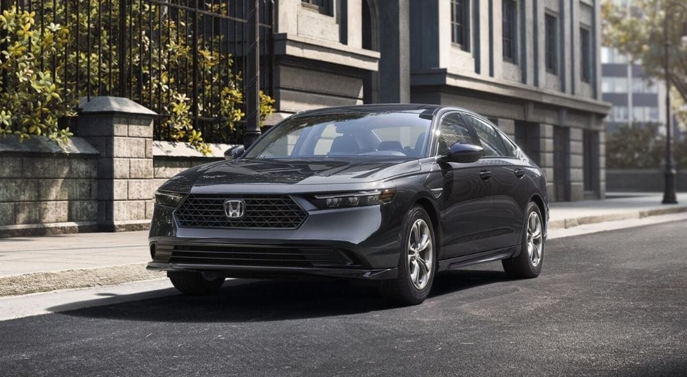 A gray 2026 Honda Accord LX parked on a city street.
