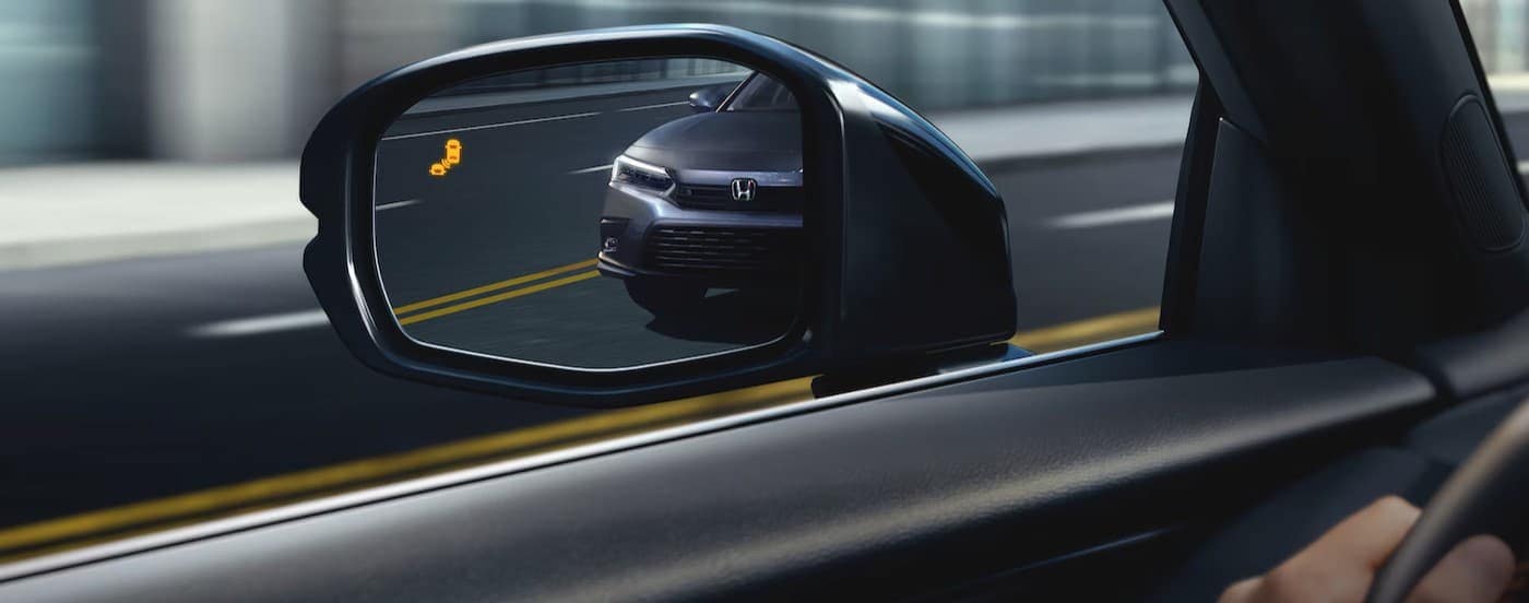 Side view mirror in a black 2025 Honda HR-V.