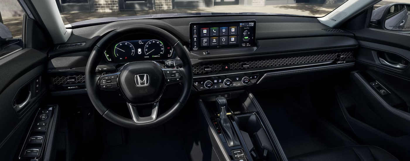 The steering wheel and infotainment screen in a 2024 Honda Accord for sale.