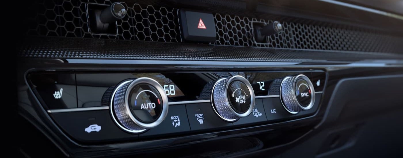 Close-up of knobs on the black dash in a 2025 Honda CR-V.