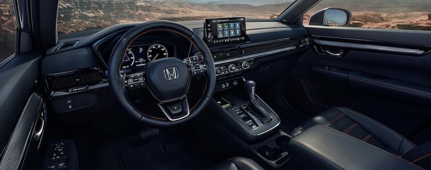 The black interior and dash in a 2023 Honda CR-V.