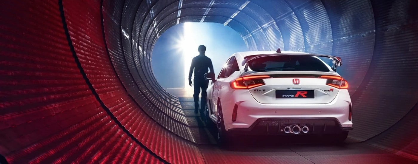 A white 2023 Honda Civic Type R is shown in a tunnel.