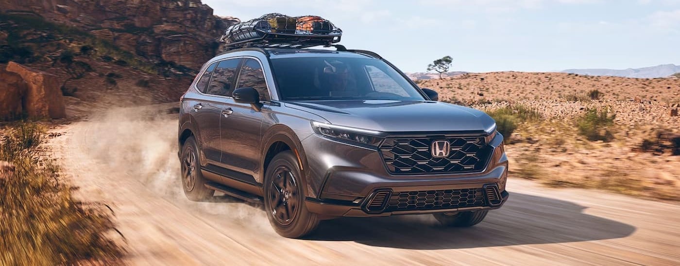 A gray 2025 Honda CR-V Sport Touring off-roading.