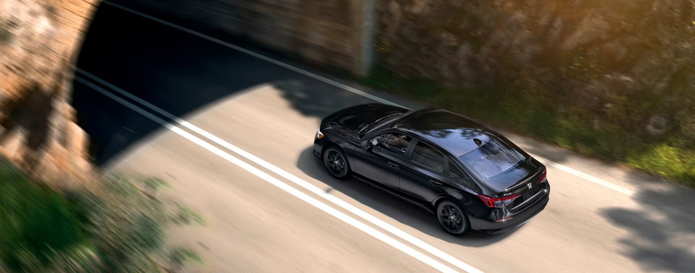 Black 2025 Honda Civic driving through a tunnel