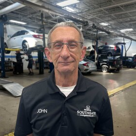 Staff member John Surerus from ID_66ad0bbfd8c7