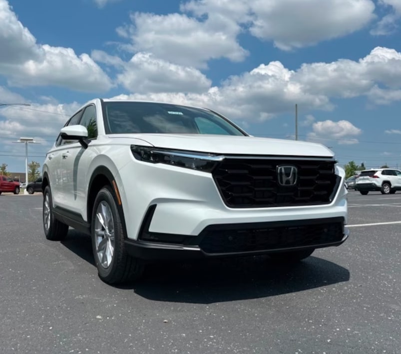 A white 2024 Honda CR-V on a cloudy day.