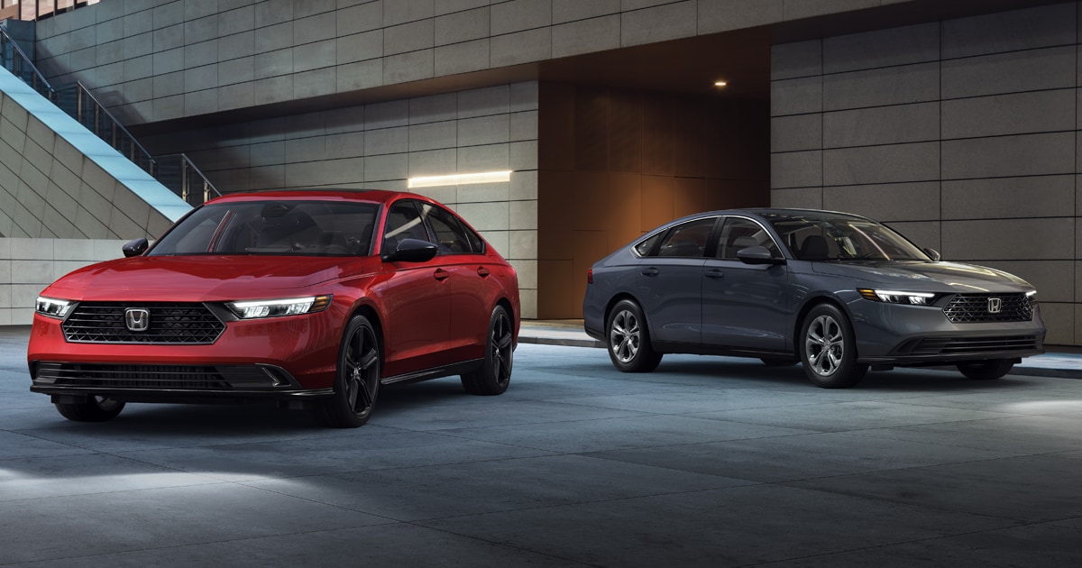 2 Honda Accord vehicles parked beside each other.