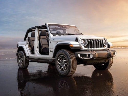2025 Jeep Wranlger parked on a beach with the doors off