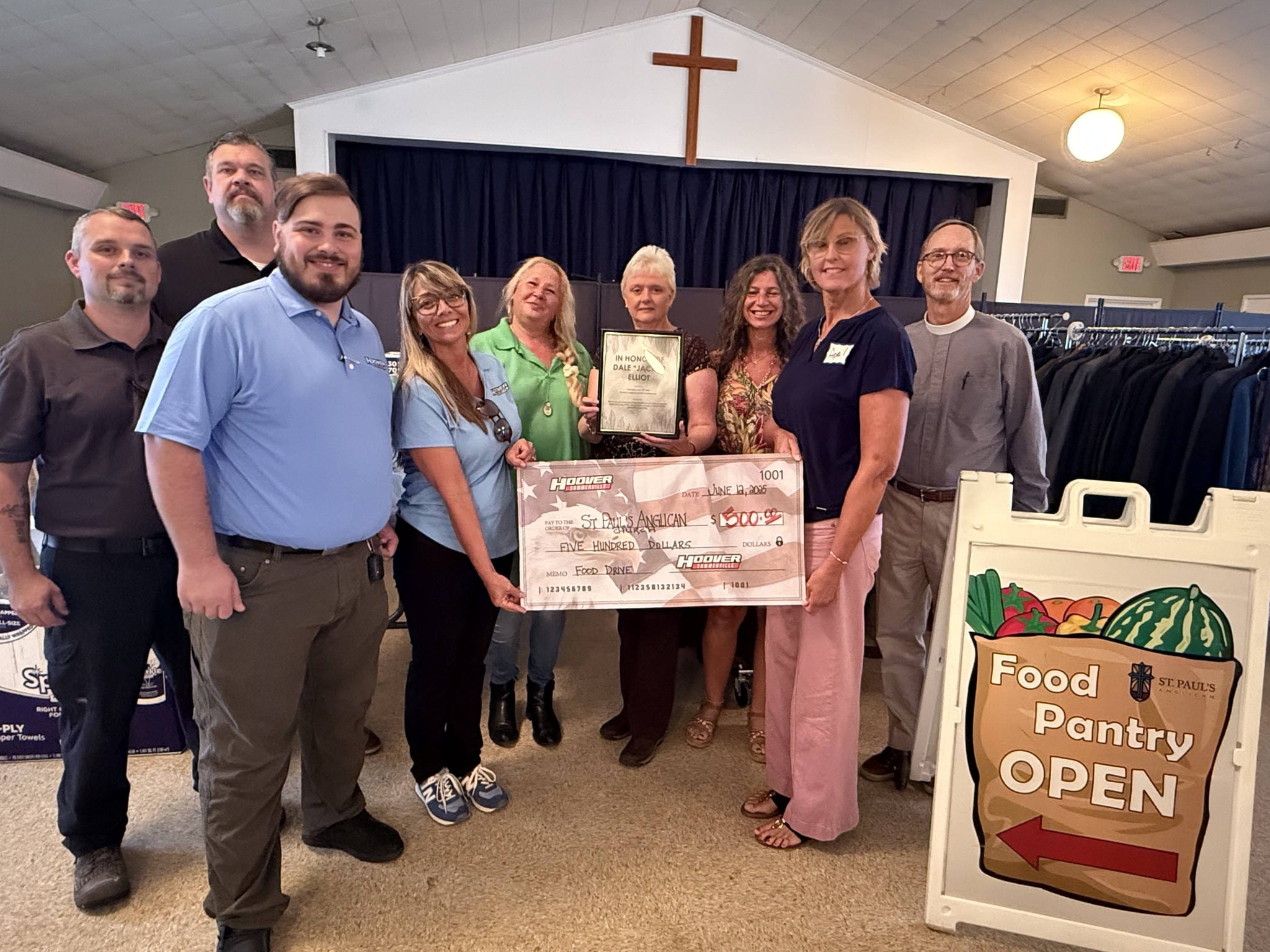 Hoover team presenting check at St Pauls Food Pantry
