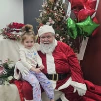 Child sitting on Santa lap at Hoover Summerville