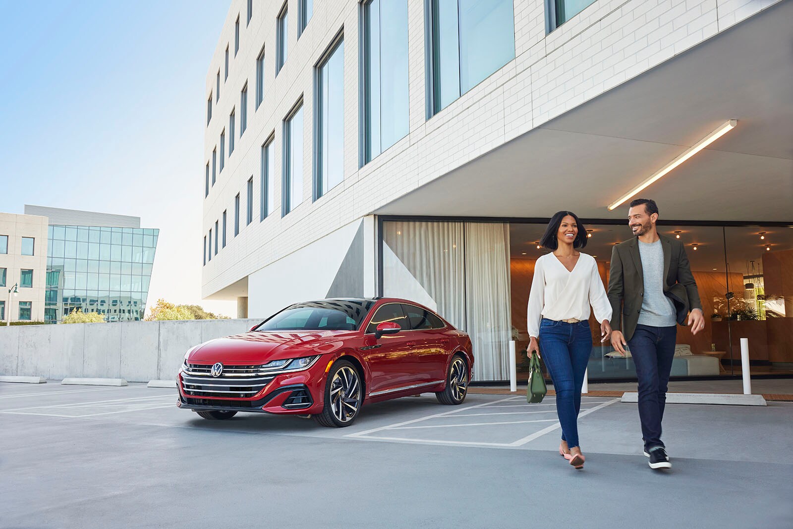 MY23_Arteon_SEL_Premium_R-Line_4MOTION_Kings_Red_Metallic-_Lifestyle_-_Front_3_4.jpg
