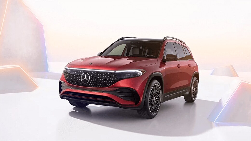 Rendered image of a Mercedes-Benz EQB SUV surrounded by geometric shapes
