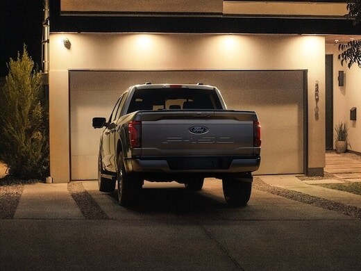 2024 Ford F150® PowerBoost® Hybrid pickup being driven on an open road