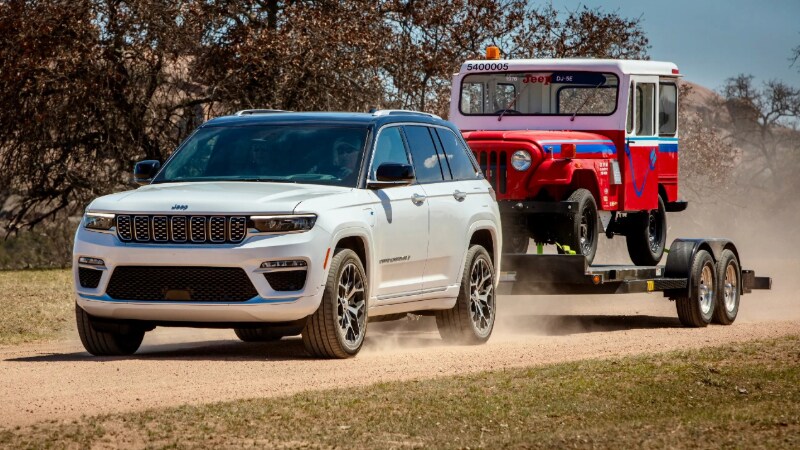 2024 Jeep Grand Cherokee 4xe towing a jeep wrangler