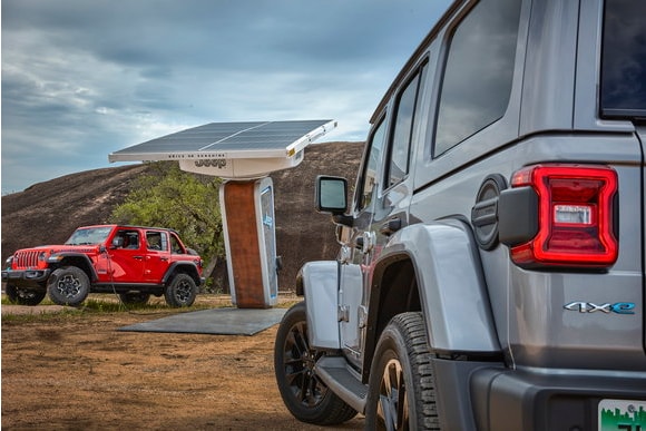 2024 Jeep Wrangler 4xe charging at a charging station