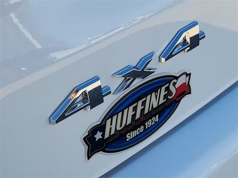 4x4 emblem on a Jeep parked at the Huffines CDJR Plano dealership in Plano, TX
