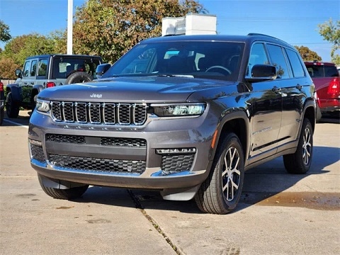 grey 2025 jeep grand cherokee SUV parked at the Huffines CDJR Plano dealership in Plano, TX