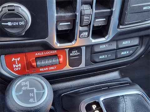 jeep offroad controls in the cabin of a 2025 Jeep Wrangler SUV parked at the Huffines CDJR Plano dealership in Plano, TX