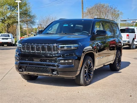 black 2024 jeep grand wagoneer SUV parked at the Huffines CDJR Plano dealership in Plano, tx