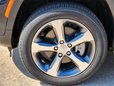 tire and wheel on a Jeep at the Huffines CDJR Plano dealership in Plano, TX