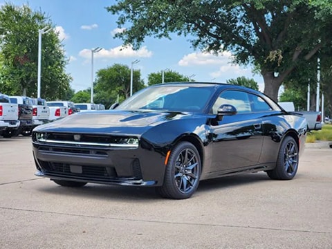 black 2026 Dodge Charger 2-door coupe parked at the Huffines CDJR Plano dealership in Plano, TX