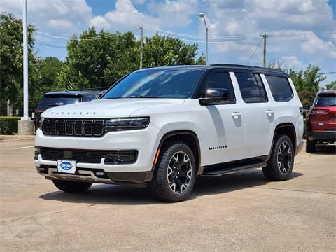 white 2025 jeep wagoneer SUV parked at the Huffines CDJR Plano dealership in Plano, TX