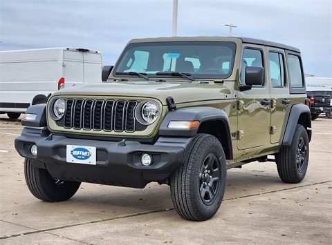 green Jeep Wrangler SUV parked at the Huffines CDJR Plano dealership in Plano, TX