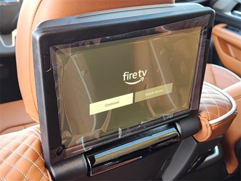 rear seat built in TV in a 2026 Chrysler Pacifica minivan parked at the Huffines CDJR Plano dealership in Plano, TX
