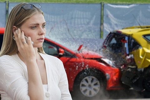 person standing next to a car accident 