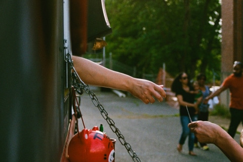 person buying food at a food truck in plano, tx